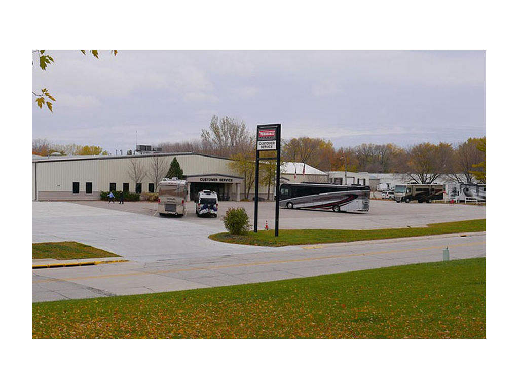 Motorhomes parked in the Winnebago Factory Service Center parking lot