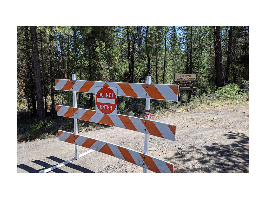 Barricaded road of closed campground 