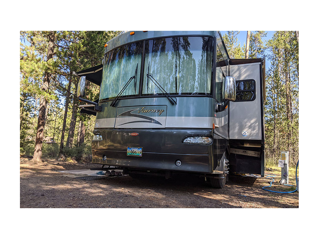 Winnebago Journey parked in campsite