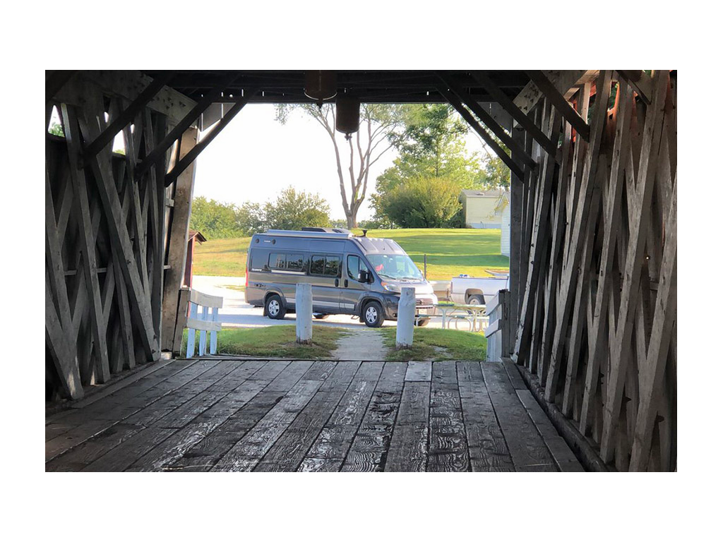 Shot of the Travato taken from the inside of the Imes Covered Bridge