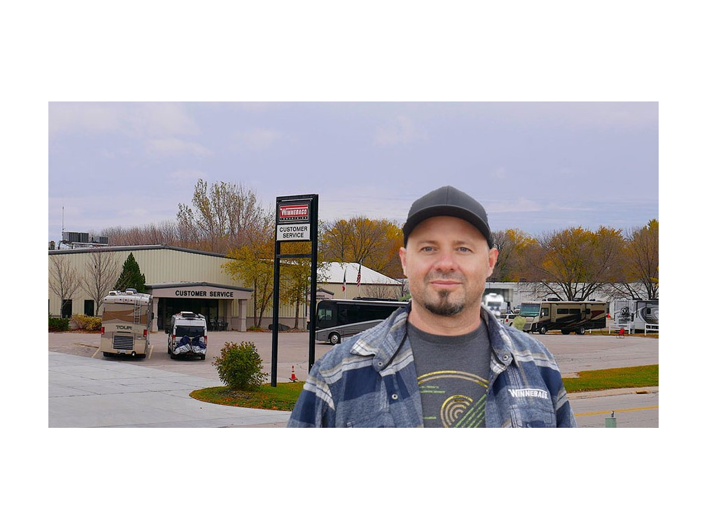 Kenny standing in front of Factory Service Center