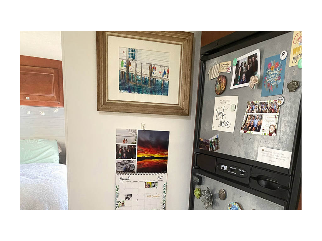 Display of photos on wall and on fridge