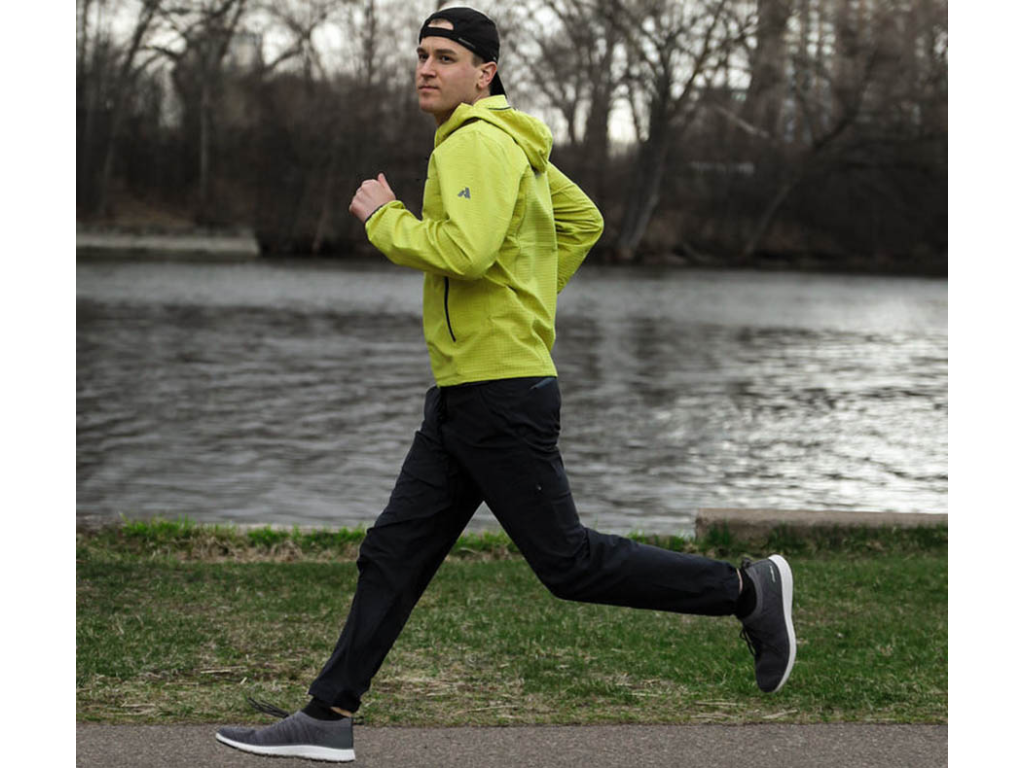 Mikah running in Minneapolis near water