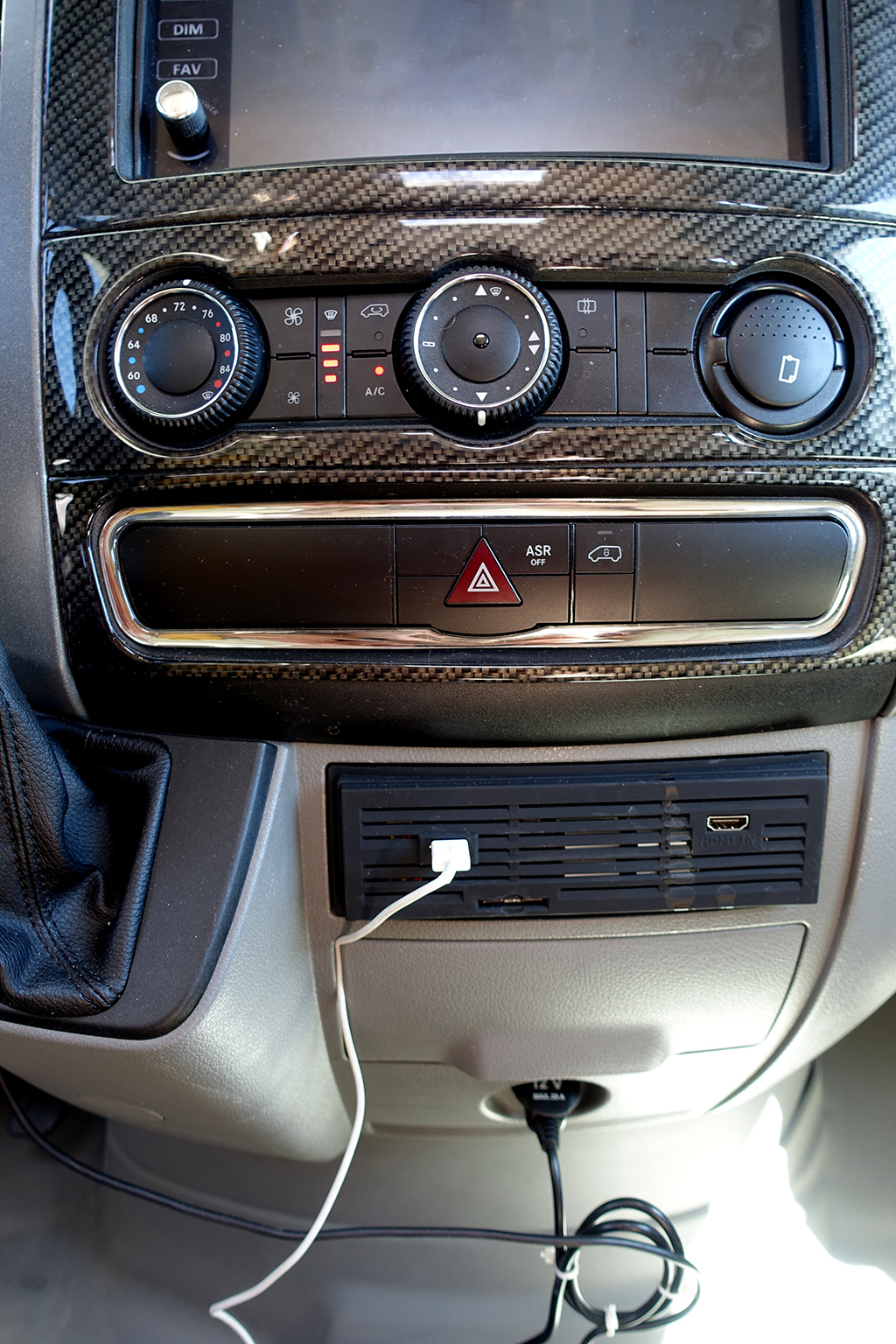 Air controls and plug ins on front dash.