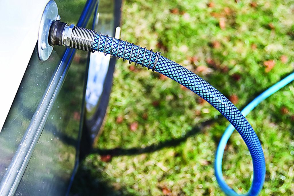 Fresh water hose hooked up to the RV water hookup point