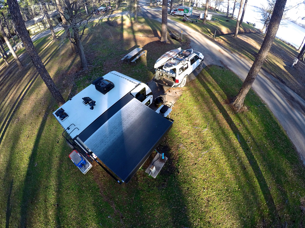 Overhead view of Winnebago Micro Minnie with awning out in campsite.
