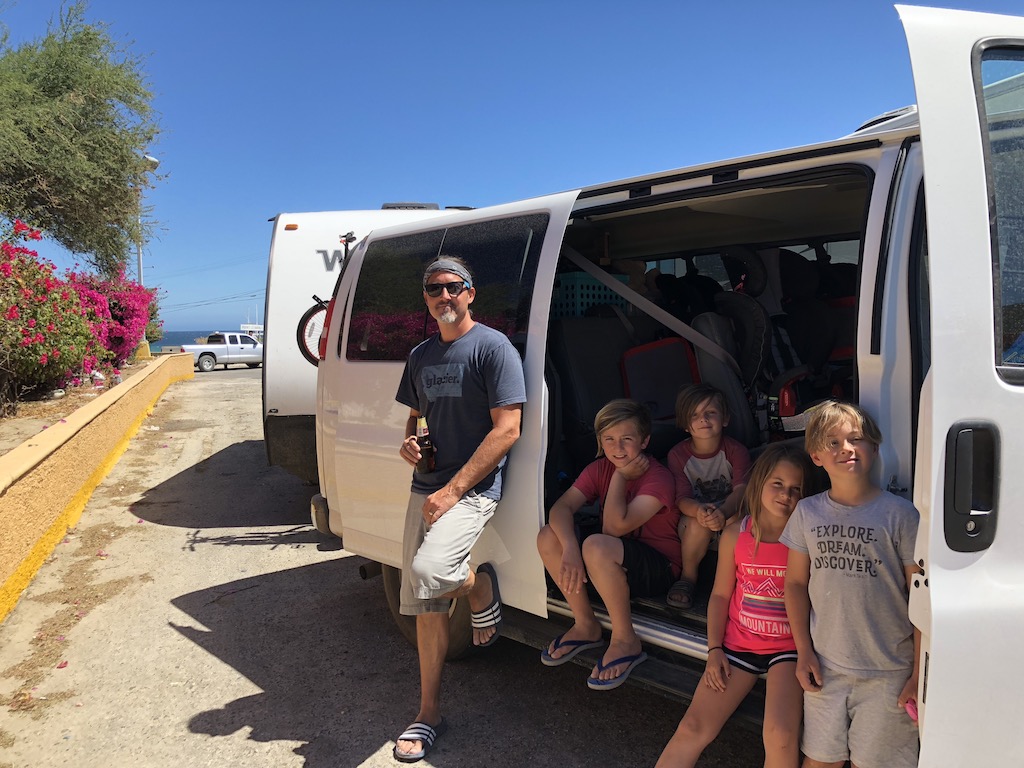Craig and four kids standing outside of van with Micro Minnie behind it