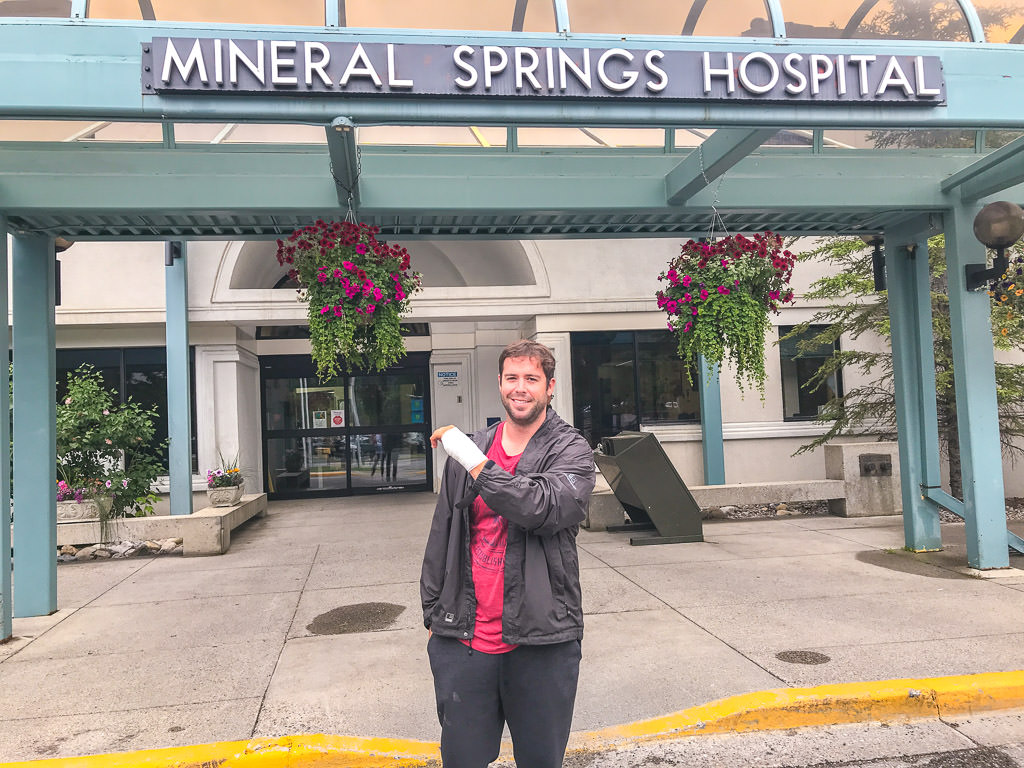 Dan in front of Mineral Springs Hospital with wrapped wrist