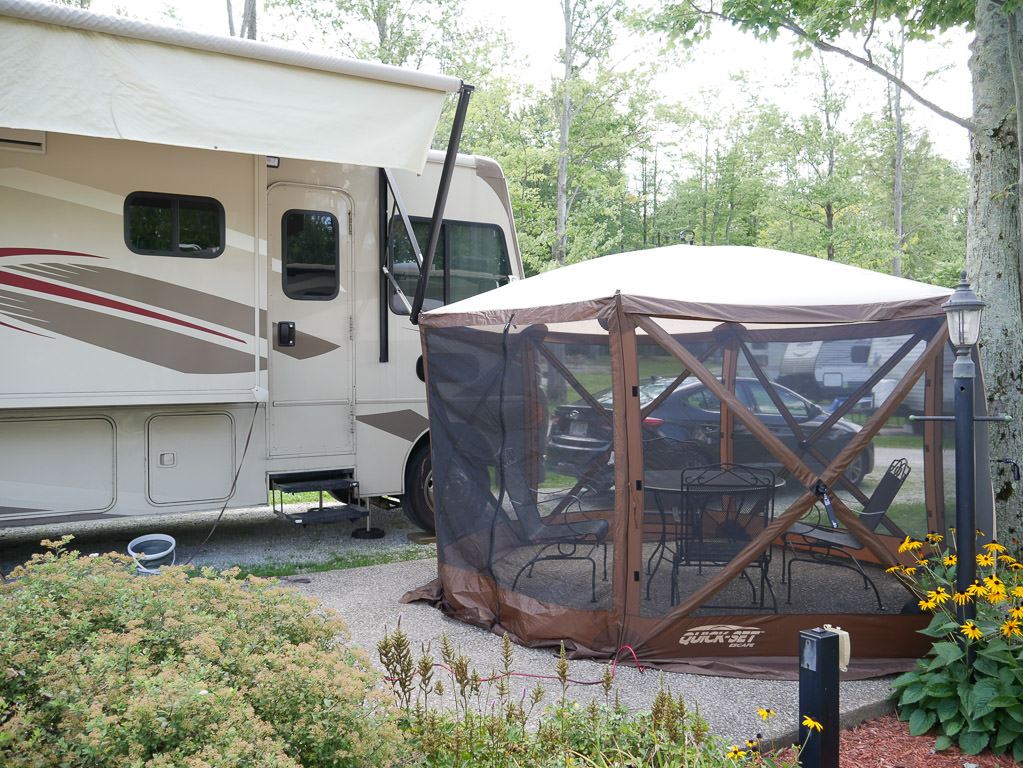 Quick set up gazebo in place next to Winnebago Vista in camp