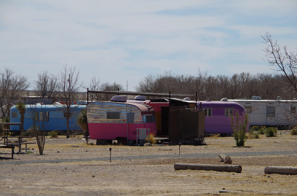 RV Park with colorful vintage trailers mixed among some newer ones.