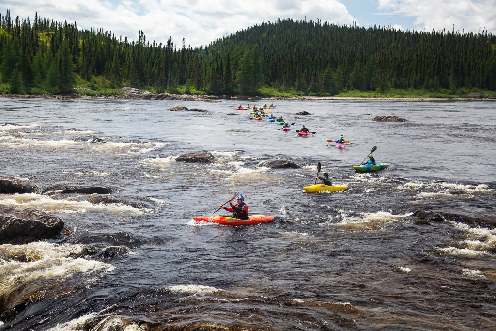 Line of kayakers on the Magpie River